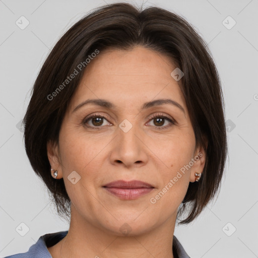 Joyful white adult female with medium  brown hair and brown eyes