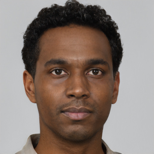 Neutral black young-adult male with short  black hair and brown eyes