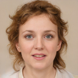 Joyful white young-adult female with medium  brown hair and blue eyes