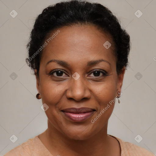 Joyful black adult female with short  brown hair and brown eyes