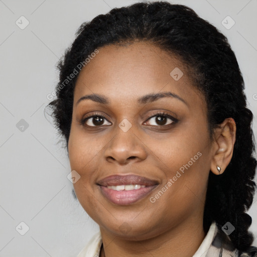 Joyful black young-adult female with short  brown hair and brown eyes