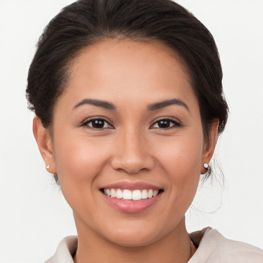 Joyful white young-adult female with medium  brown hair and brown eyes