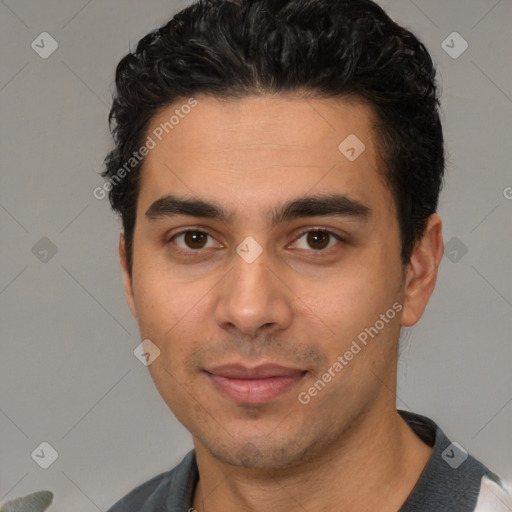 Joyful white young-adult male with short  black hair and brown eyes