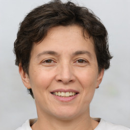 Joyful white adult female with short  brown hair and brown eyes