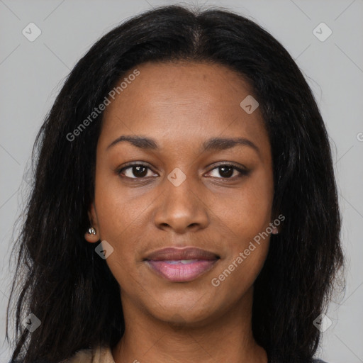 Joyful black young-adult female with long  brown hair and brown eyes