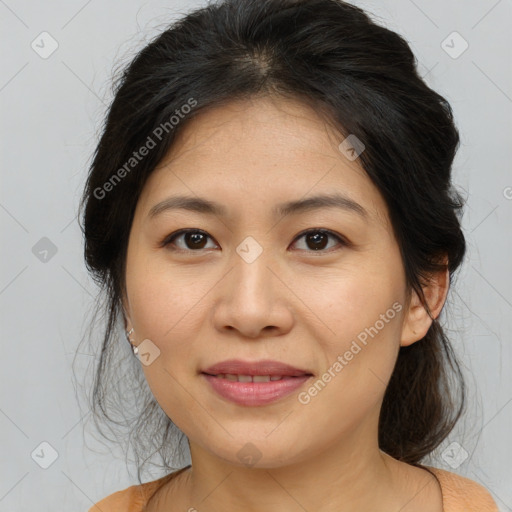 Joyful asian young-adult female with medium  brown hair and brown eyes