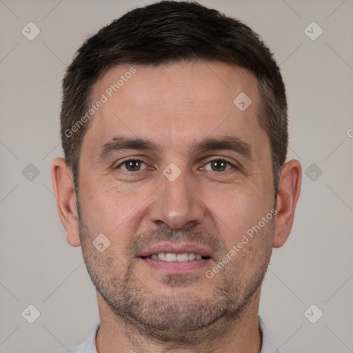 Joyful white adult male with short  brown hair and brown eyes