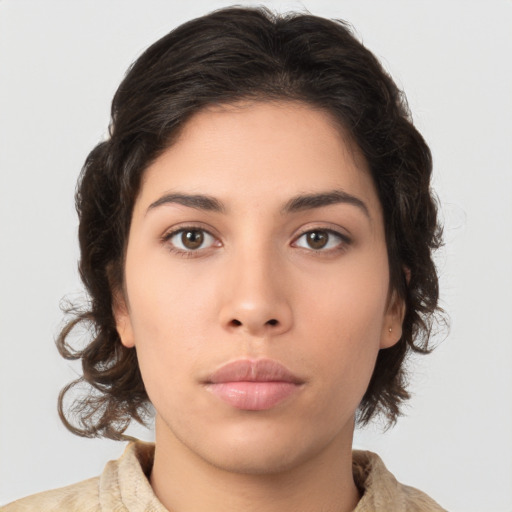 Neutral latino young-adult female with medium  brown hair and brown eyes