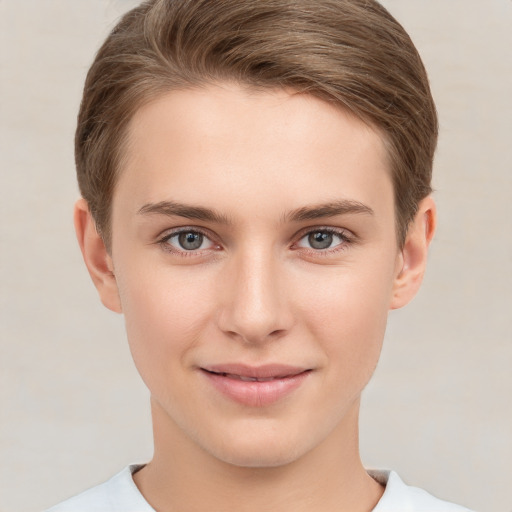 Joyful white young-adult female with short  brown hair and grey eyes