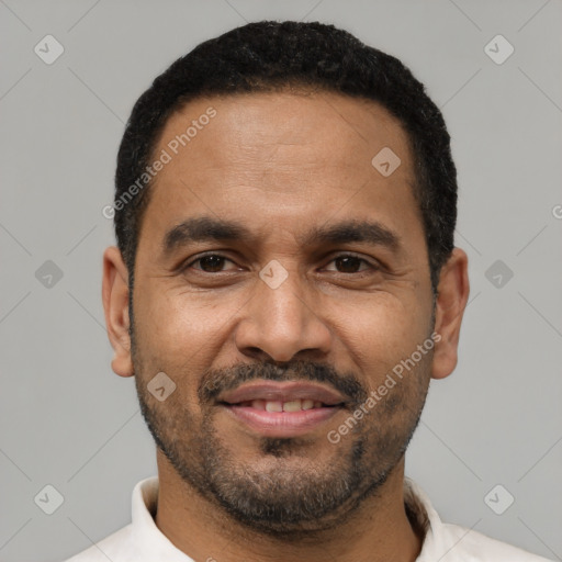 Joyful latino adult male with short  black hair and brown eyes