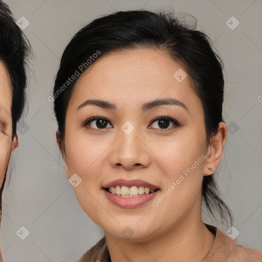 Joyful asian young-adult female with medium  brown hair and brown eyes