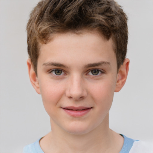 Joyful white child male with short  brown hair and grey eyes