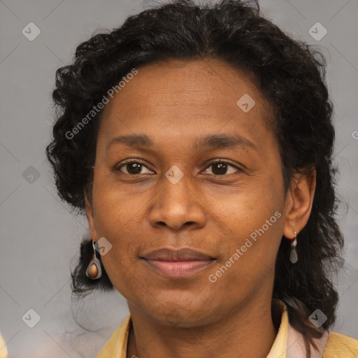 Joyful black adult female with short  brown hair and brown eyes