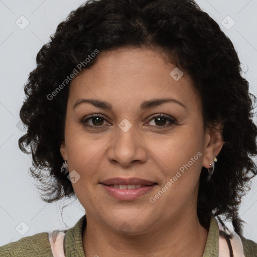 Joyful latino adult female with medium  brown hair and brown eyes