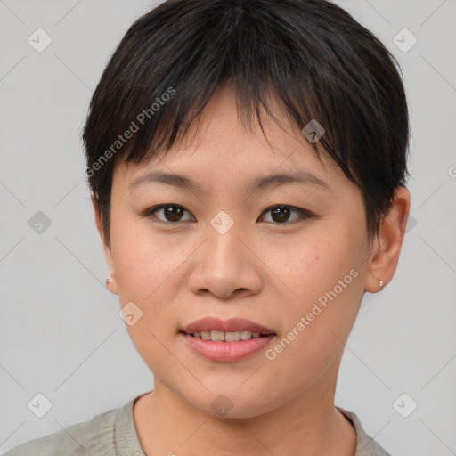 Joyful asian young-adult female with short  brown hair and brown eyes