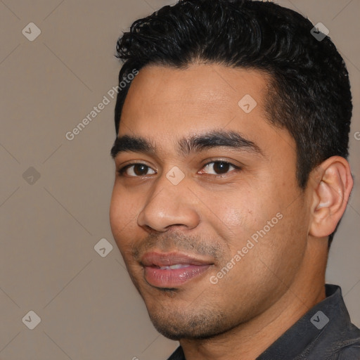Joyful latino young-adult male with short  black hair and brown eyes