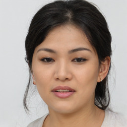 Joyful asian young-adult female with medium  brown hair and brown eyes