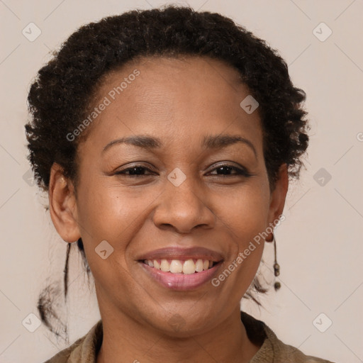 Joyful black adult female with short  brown hair and brown eyes