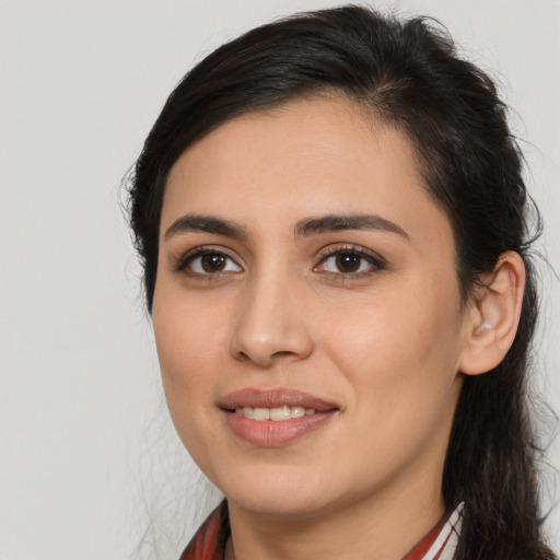 Joyful white young-adult female with medium  brown hair and brown eyes