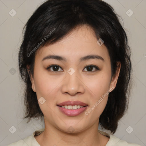 Joyful asian young-adult female with medium  brown hair and brown eyes