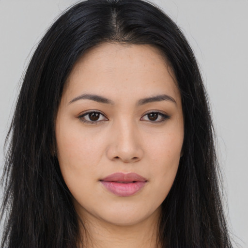 Joyful asian young-adult female with long  black hair and brown eyes
