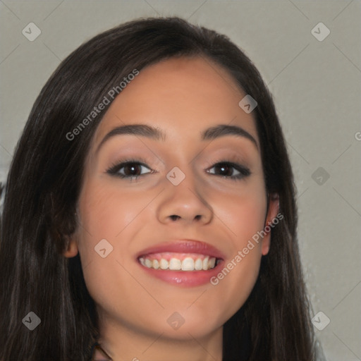 Joyful latino young-adult female with long  brown hair and brown eyes