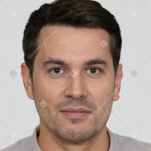 Joyful white adult male with short  brown hair and brown eyes