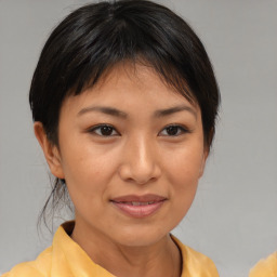 Joyful white young-adult female with medium  brown hair and brown eyes