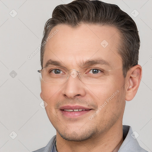 Joyful white adult male with short  brown hair and brown eyes