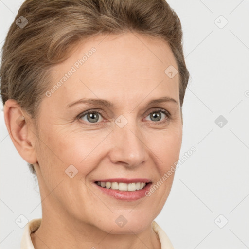 Joyful white adult female with short  brown hair and brown eyes