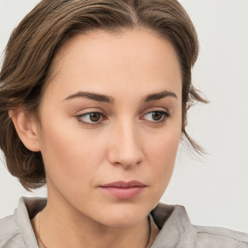 Neutral white young-adult female with medium  brown hair and grey eyes