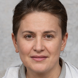 Joyful white adult female with short  brown hair and brown eyes