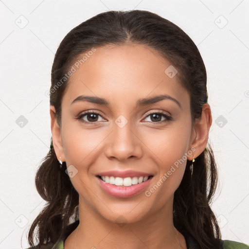 Joyful white young-adult female with long  brown hair and brown eyes