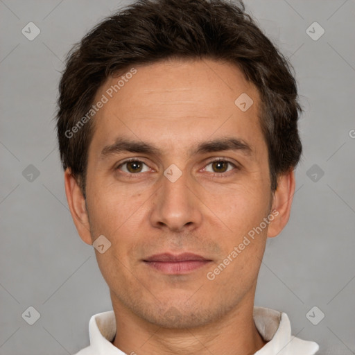 Joyful white young-adult male with short  brown hair and brown eyes