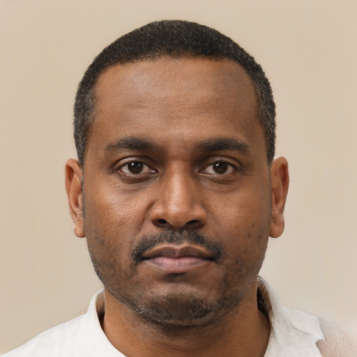 Neutral black young-adult male with short  black hair and brown eyes