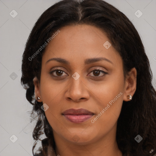 Joyful black young-adult female with long  brown hair and brown eyes