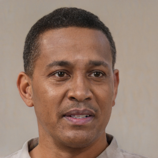 Neutral latino adult male with short  brown hair and brown eyes