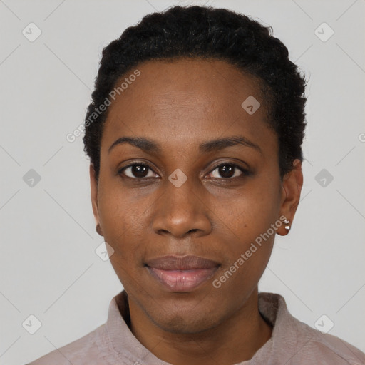 Joyful black young-adult female with short  black hair and brown eyes