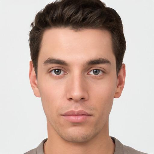 Neutral white young-adult male with short  brown hair and brown eyes