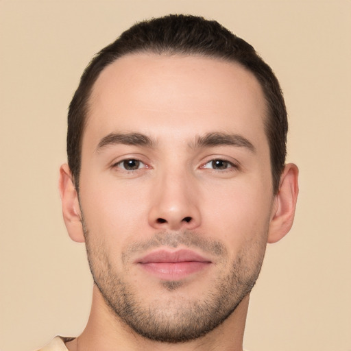 Joyful white young-adult male with short  brown hair and brown eyes