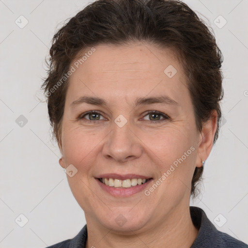 Joyful white adult female with short  brown hair and grey eyes