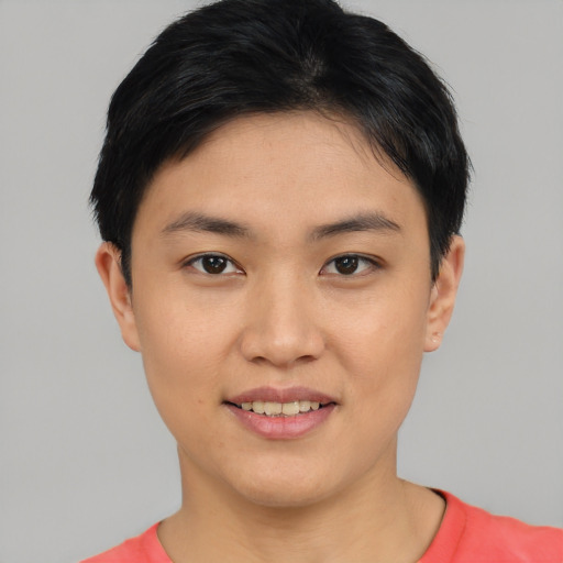 Joyful asian young-adult female with short  black hair and brown eyes