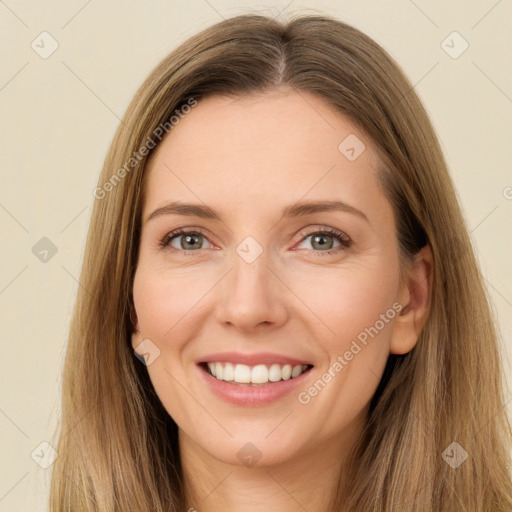 Joyful white young-adult female with long  brown hair and green eyes