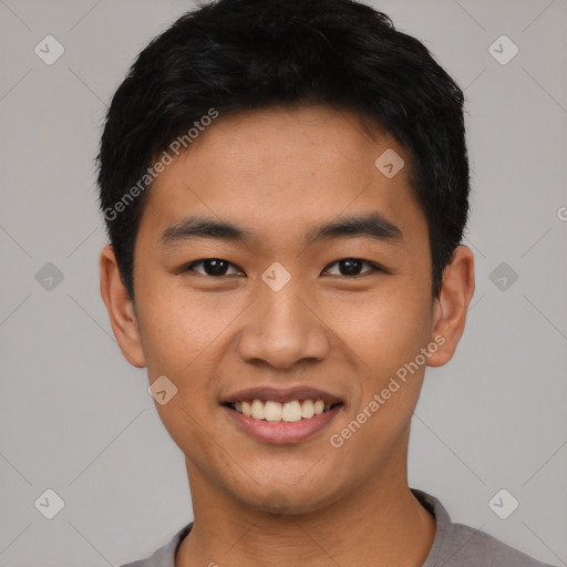 Joyful asian young-adult male with short  black hair and brown eyes