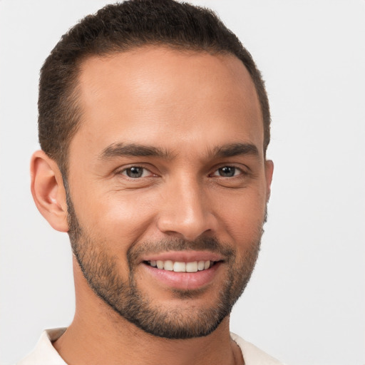 Joyful white young-adult male with short  brown hair and brown eyes