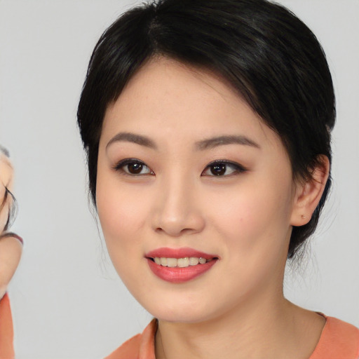 Joyful white young-adult female with medium  black hair and brown eyes