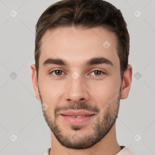 Joyful white young-adult male with short  brown hair and brown eyes