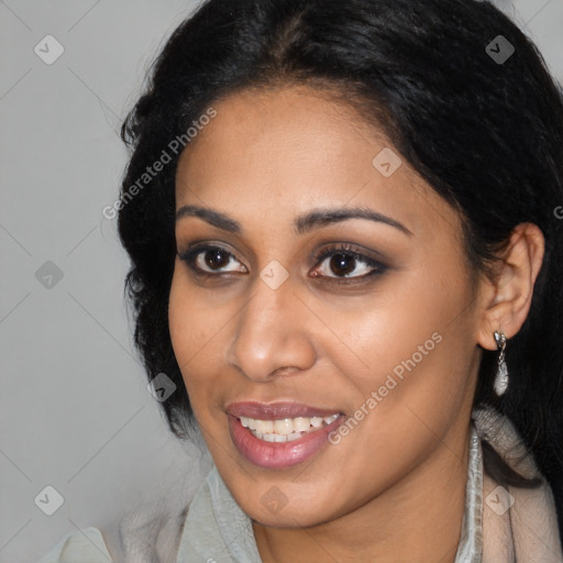 Joyful black young-adult female with long  black hair and brown eyes