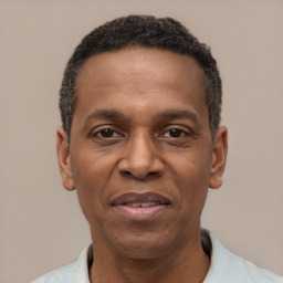 Joyful latino adult male with short  black hair and brown eyes