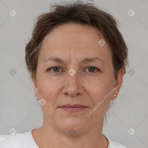 Joyful white adult female with short  brown hair and brown eyes